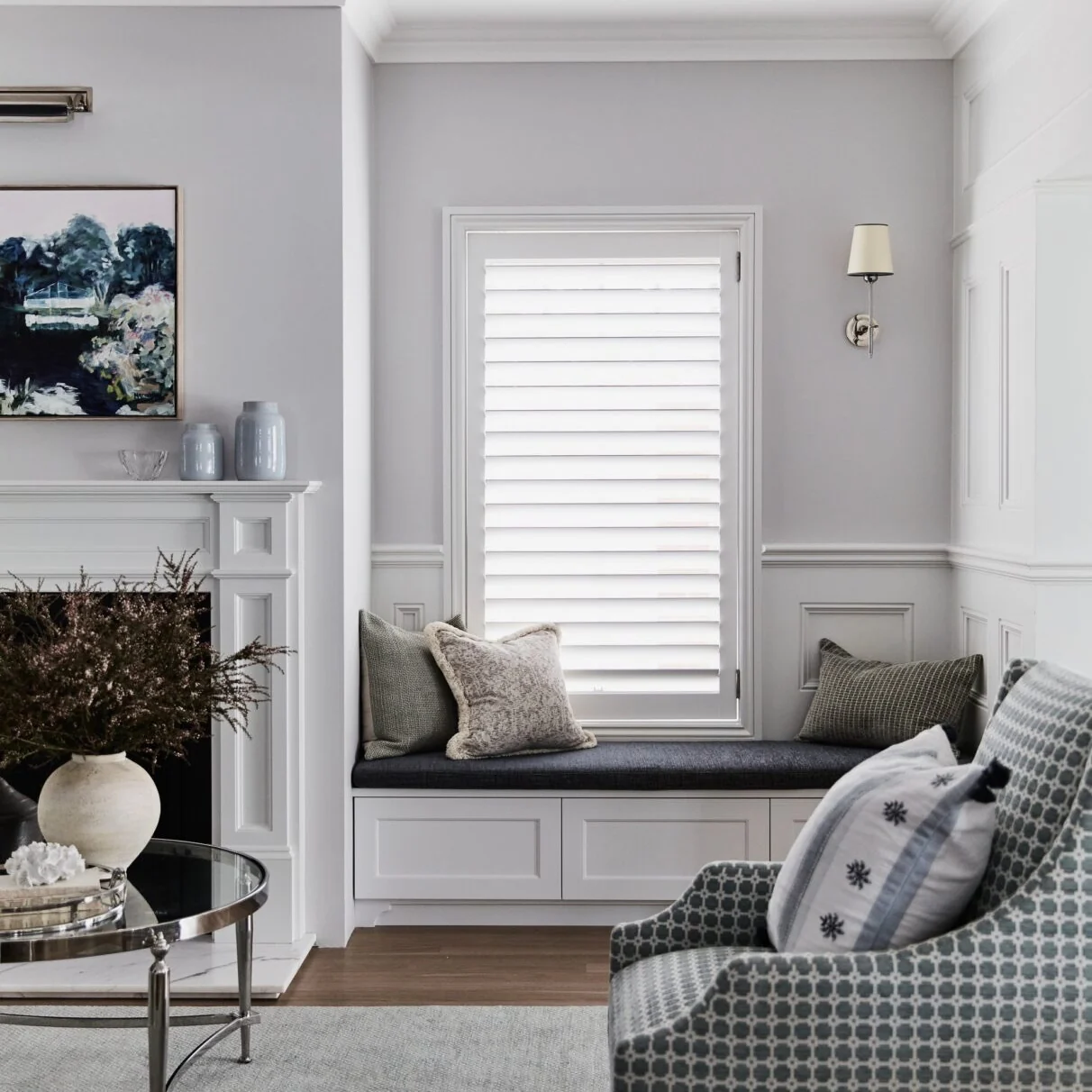 Window seat built into the panelled wall beside the fireplace in the front living room, Concord