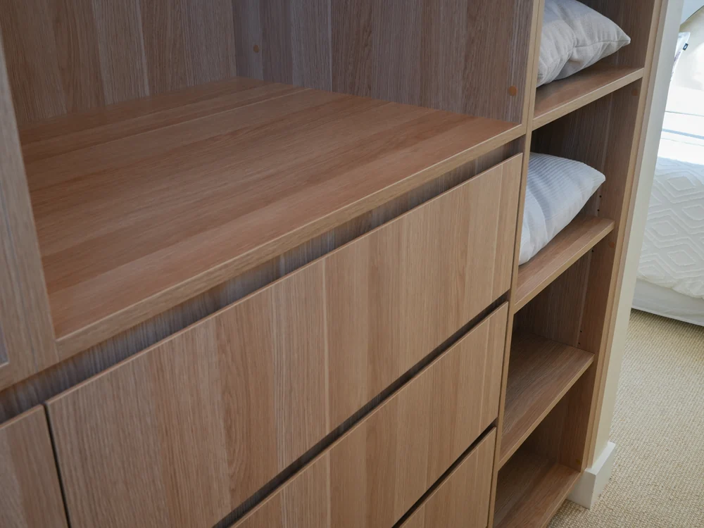 Walk-in robe with open oak shelving